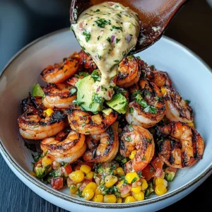 Close-up of grilled shrimp bowl with cilantro garnish and lime wedge