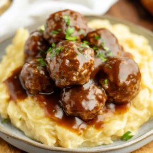 Homemade Salisbury meatballs served over creamy mashed potatoes