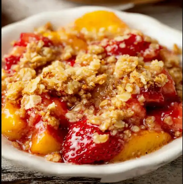 Strawberry_Peach_Crisp_1_result Close-up of golden oat topping on baked Strawberry Peach Crisp