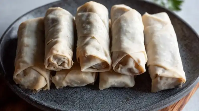 Cheeseburger_Egg_Rolls_0_result Ground beef, cheese, and pickles mixture being spooned onto an egg roll wrapper