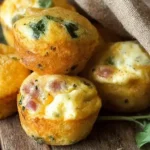 Close-up of golden, fluffy egg bites on a white serving plate