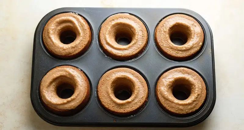 Apple_Cider_Donuts_Recip_0_result Simmering apple cider reducing in a saucepan to one half cup