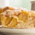 Freshly baked apple pie coffee cake with vanilla glaze drizzle