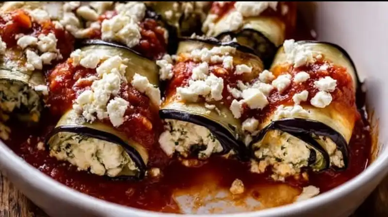 Eggplant_Rollatini_Recip_3_result Rolling baked eggplant slices around creamy ricotta filling before baking