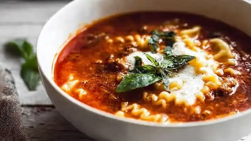 Lasagna_Soup_Recipe_set_1_result Comforting lasagna soup garnished with fresh basil and Parmesan