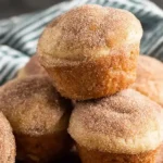 Warm donut muffins dipped in butter and rolled in cinnamon sugar